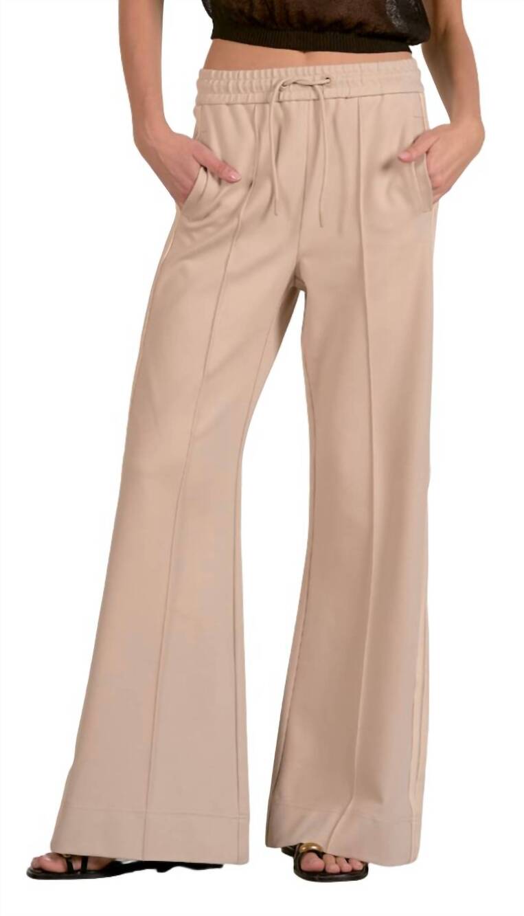 NEW ELAN wide-leg track pants in beigenat